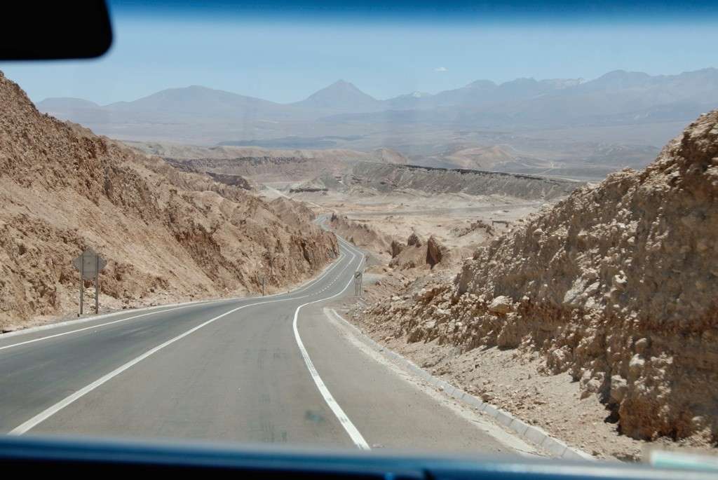 A mini-bus driving photographers through the Atacama desert