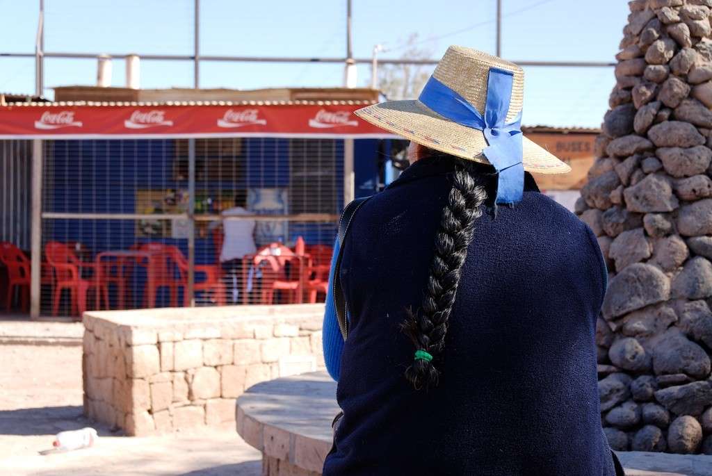 A native lady sitting in San Pedro de Atacama