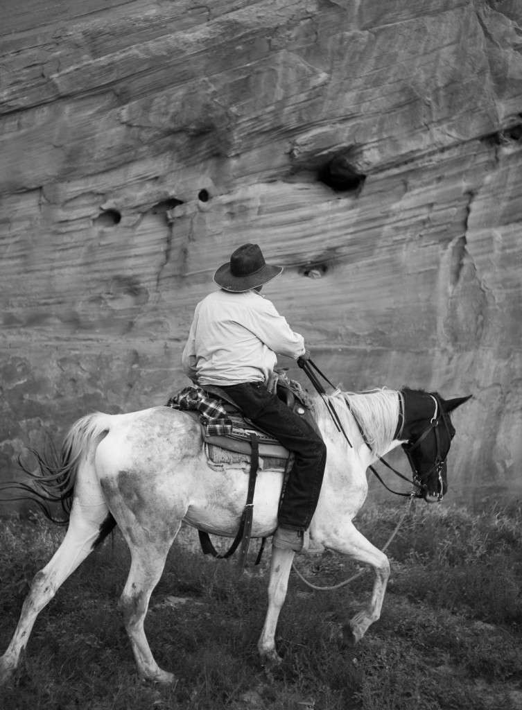 A Navajo guide on horseback inside Canyon de Chelly