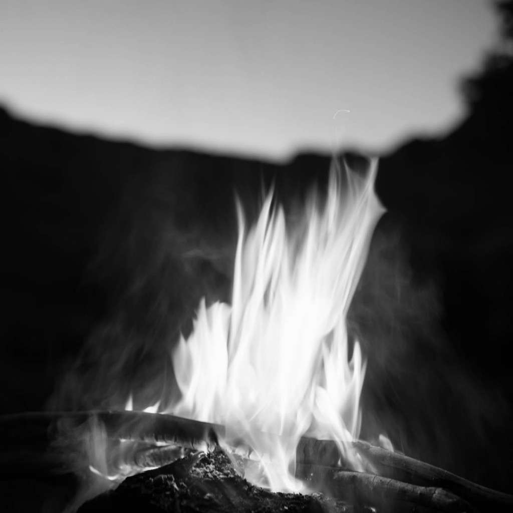 A campfire at night inside Canyon de Chelly